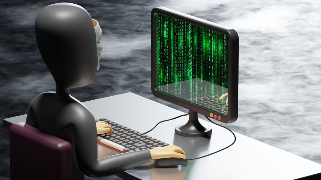 robot sitting in front of computer