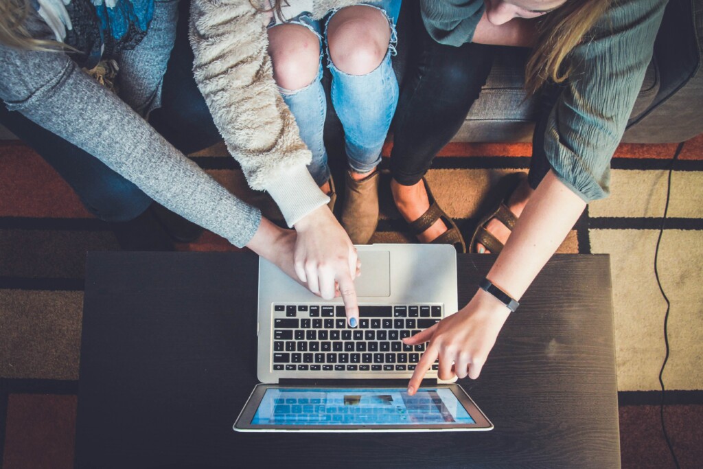 group of people looking at computer screen